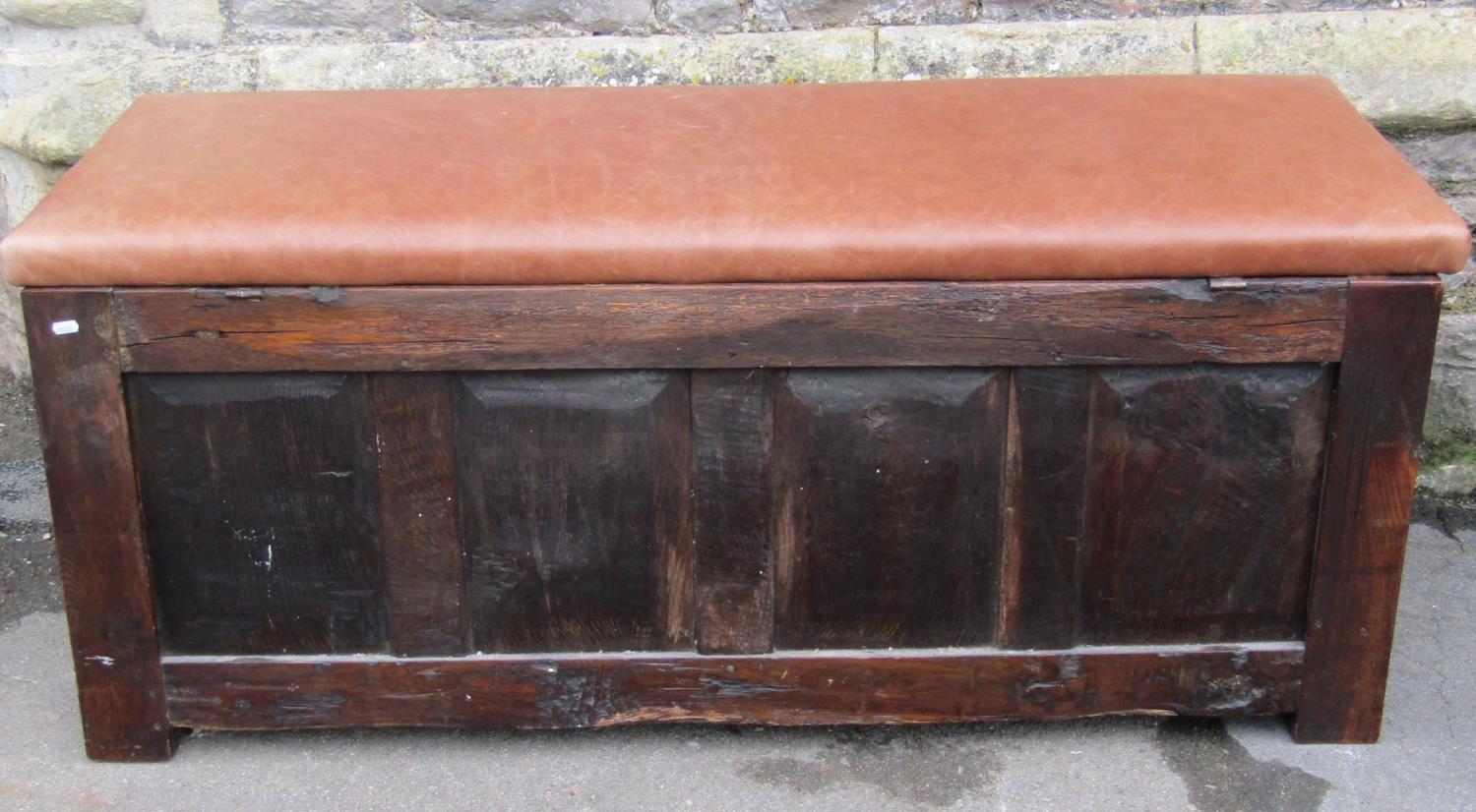 An 18th century oak coffer with panelled frame, moulded styles and carved foliate detail beneath a - Image 3 of 4