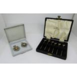 A cased silver three piece condiment set, each body of circular form, salt, pepper and mustard,