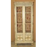 A small louis XV1 style freestanding painted side cabinet enclosed by a pair of full length doors