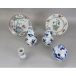 A collection of oriental ceramics including a pair of double gourd shaped blue and white painted