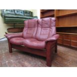 Ekornes Stressless two seater sofa with maroon leather upholstery, 150cm long