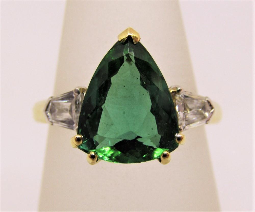 18ct pear cut green tourmaline and diamond ring, size O, maker T T, 5.6g