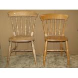 A set of four contemporary Windsor beechwood kitchen chairs with turned spindlebacks