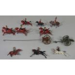 Collection of vintage painted lead toys comprising Britains Horse Artillery and outriders with field