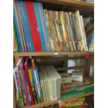 An extensive collection of Rupert Bear books and jigsaw puzzles, etc, including a number of