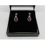 Pair of 18ct white gold ruby and diamond drop earrings, 2.5g