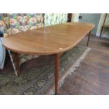 Nils Jonsson Swedish teak extending dining table, the oval top on four tapered legs, with two