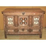 A small 18th century oak mule chest with hinged lid over a moulded panelled frame, the front