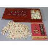 Mahjong set in wooden case with instructions
