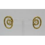 Pair of stylised 18ct diamond set clip earrings, 10.2g total