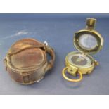 WWI brass pocket compass with leather case 1917, number 90542 and WWII military marching compass,
