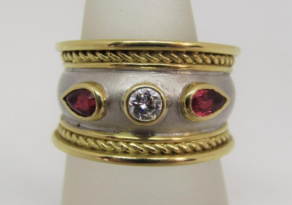 Byzantine style 18ct bi-colour gold ring set with a round cut diamond flanked by a pair of pear