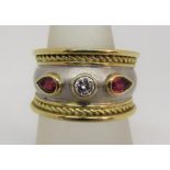 Byzantine style 18ct bi-colour gold ring set with a round cut diamond flanked by a pair of pear