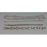 Group of silver jewellery comprising a curb link necklace and three bracelets of various design (4)