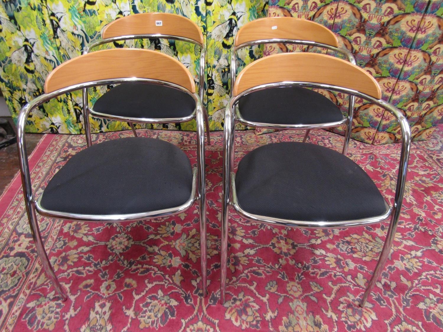 Effezeta - Set of four chairs with shaped beech back and black upholstered seats upon chrome frames,