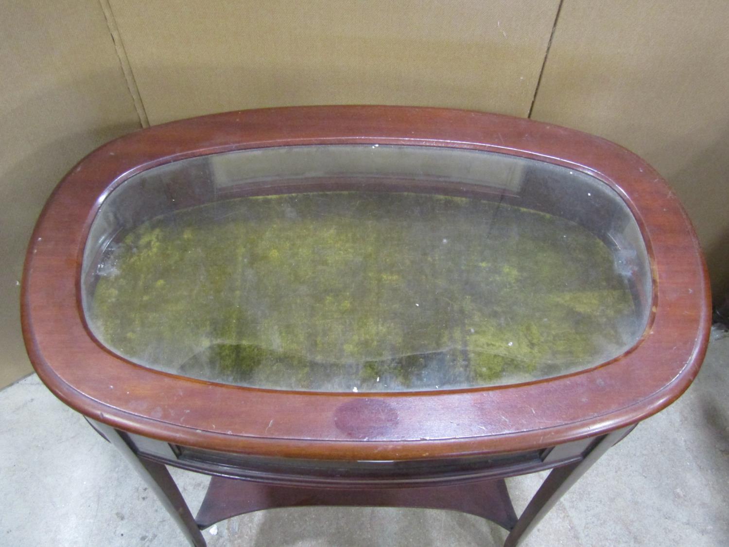 An Edwardian mahogany vitrine, body of oval form with glass top and side panels raised on four swept - Image 2 of 2
