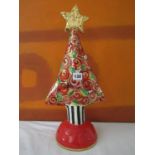 Mary Rose Young Studio Christmas tree, mounted by a gilt star, the tree with geometric decoration of