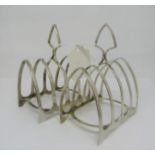 A pair of silver four division toast racks, Sheffield 1905 and 1906, 4oz approx total