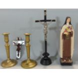 A collection of religious artefacts including two crucifix, plaster figure of the Virgin Mary,