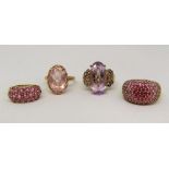 Four 9ct dress rings set with pink / purple gemstones, 19.7g total (4)