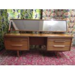 White & Newton of Portsmouth teak dressing table, with raised mirror back and two flanks of three
