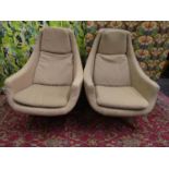 Pair of 1960s egg type swivel lounge chairs with oatmeal upholstery and four spoke teak base, each
