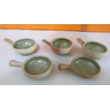 Probably by Bernard Leach - Three St Ives pottery wine tasting cups with celadon glaze interior,