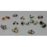 Twelve pairs of silver gem set stud earrings