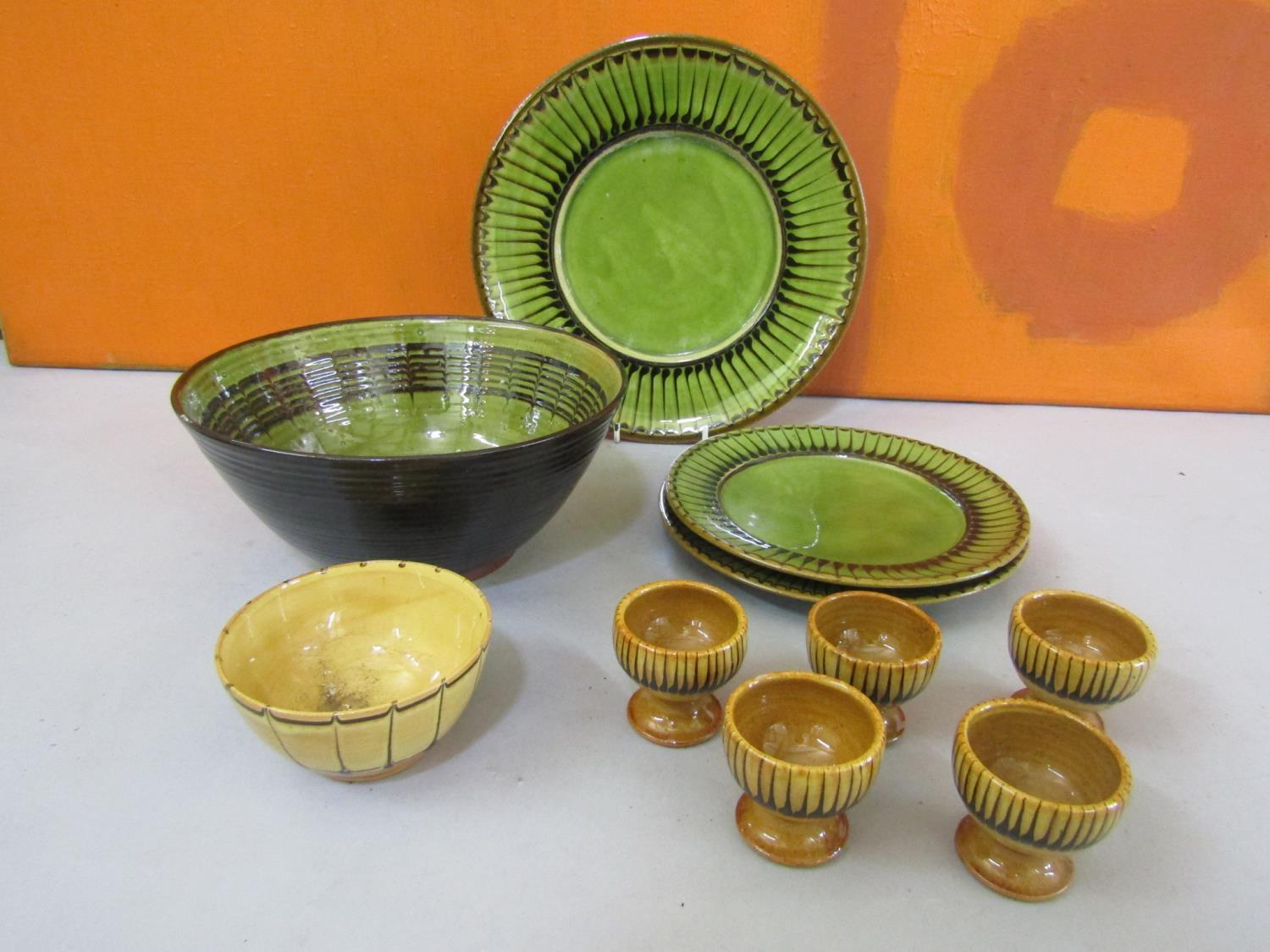 Collection of Coldstone pottery comprising three plates, five egg cups and a dish all with similar