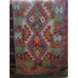 A flat weave kelim runner with diamond pattern repeating detail within running borders, 205 x 65