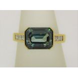 Blue zircon and princess cut diamond ring, unmarked, tests as 18ct gold, size O, 5.6g