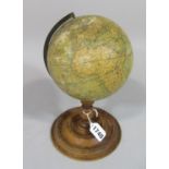 Smiths Terrestrial globe c.19th century, 15cm diameter, raised on a turned stem and base, showing