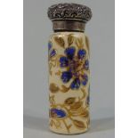 A Victorian cylindrical ceramic scent bottle with overlaid floral painted detail and embossed silver