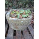A weathered natural stone trough of rectangular form with single D end, 80 cm long x 53 cm wide x 26