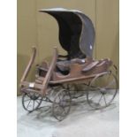 A Vintage wooden scale model buggy or trap, with winged canopied buttoned seat, sprung steel chassis