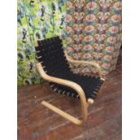 Alvar Aalto (1898 - 1976, Finland) - 406 Armchair, with woven strap work seat and back, upon a bent