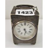 Silver cabinet or boudoir clock, with 40mm enamelled dial, Roman numerals upon three bun feet,