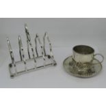 A silver toast rack with four divisions, London 1998 and a miniature silver cup and saucer with
