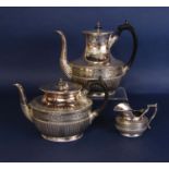 A three piece late Victorian silver plated tea and coffee service with fluted and engraved