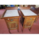 A pair of Edwardian mahogany bedside/lamp tables, the shallow raised backs with blind fretwork