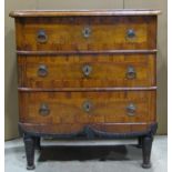 An antique walnut veneered commode of three long drawers with inlaid chequered stringing and