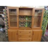 Ercol light elm sideboard, the raised back with two glazed door shelving compartments, framing a
