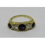 18ct five stone sapphire and diamond ring, central sapphire 0.50cts approx, size L, 4.6g