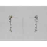Two pairs of stylised 18ct white gold diamond set earrings, 9.4g total (4)