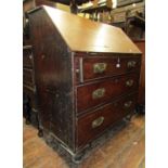 Early 19th century mahogany countrymade bureau of three long drawers, the fall flap enclosing a