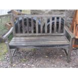 A weathered contemporary teak two seat garden bench with slatted seat and back, 122 cm (4ft long)