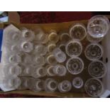 A suite of drinking glasses with cut style decoration including wine glasses, whiskey tumblers,