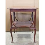 An inlaid Edwardian mahogany two tier occasional table of square cut form with serpentine outline,