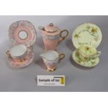 A collection of Royal Stafford tea wares in the art deco manner with floral decoration on a peach