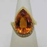 Pear cut citrine and diamond ring, unmarked, tests and 18ct gold, size O, 12.5g